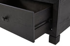 Cocktail table drawer open showing dark interior with drawer slides and pull knob
