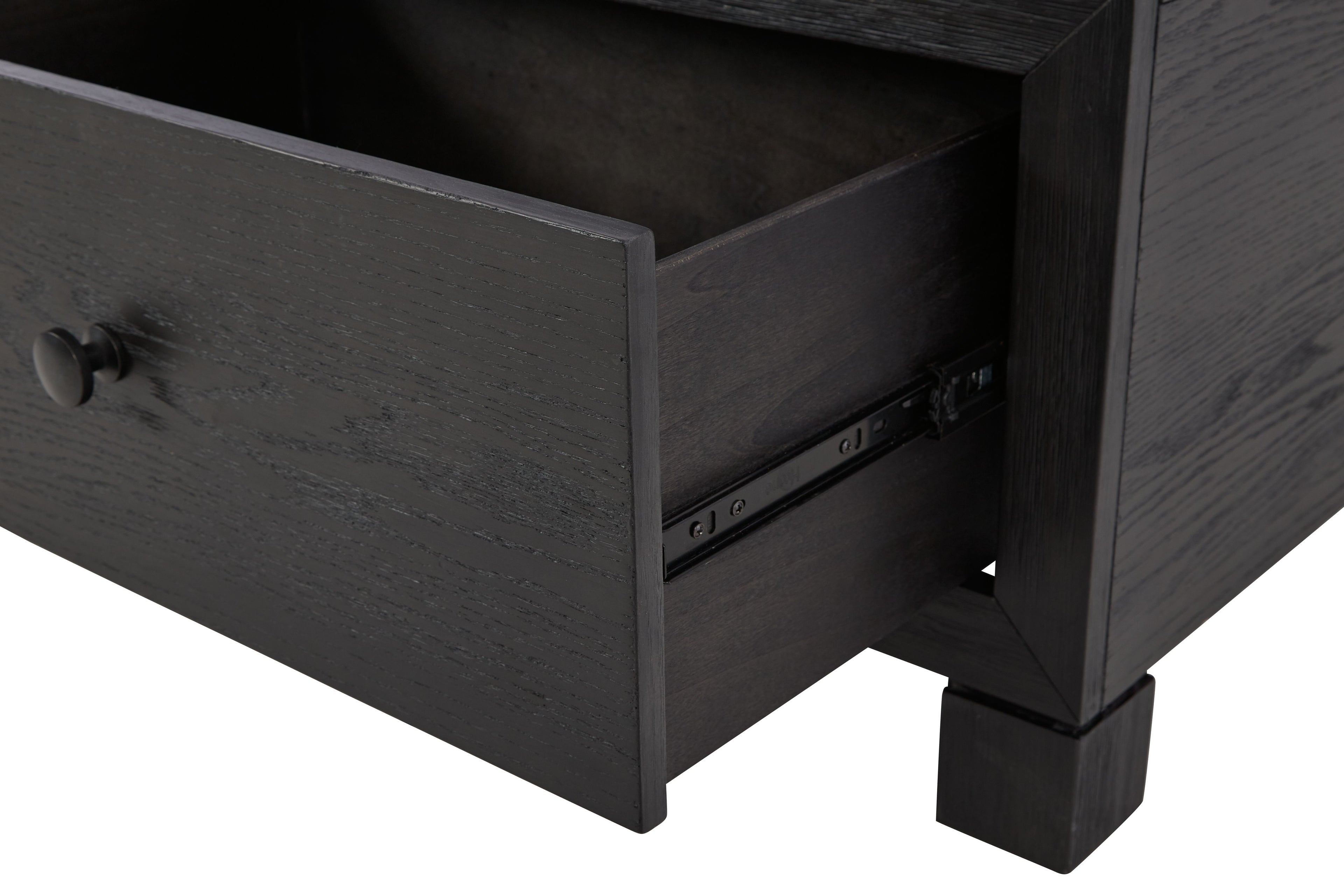 Cocktail table drawer open showing dark interior with drawer slides and pull knob