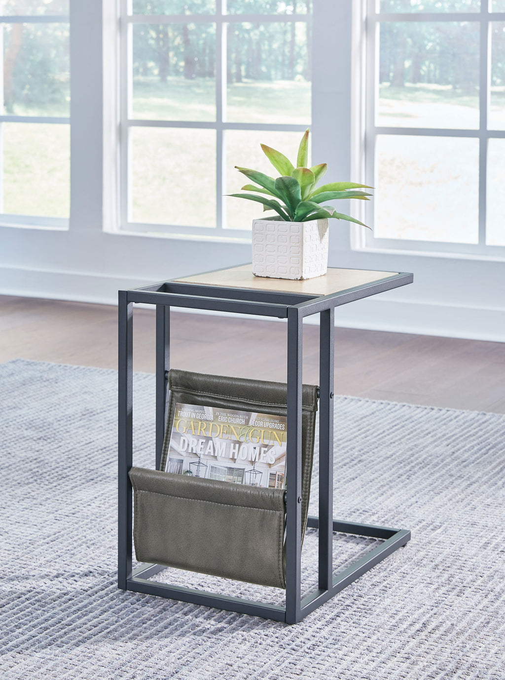 Chair side end table with magazine basket and light brown tabletop