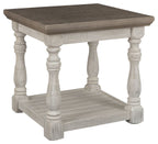 Rectangular end table with gray top, white turned legs, and lower display shelf