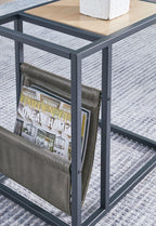 Magazine basket detail on side end table with olive panels and dark frame
