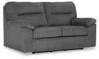 Glider loveseat, dark gray fabric with padded arms, seat and two back cushions