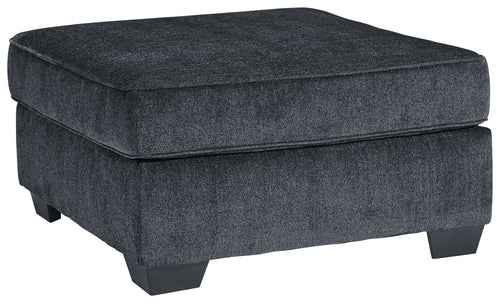 Dark gray upholstered accent ottoman with padded seat and square tapered legs