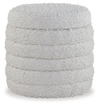 Ivory storage ottoman with quilted fabric sides and flat top lid