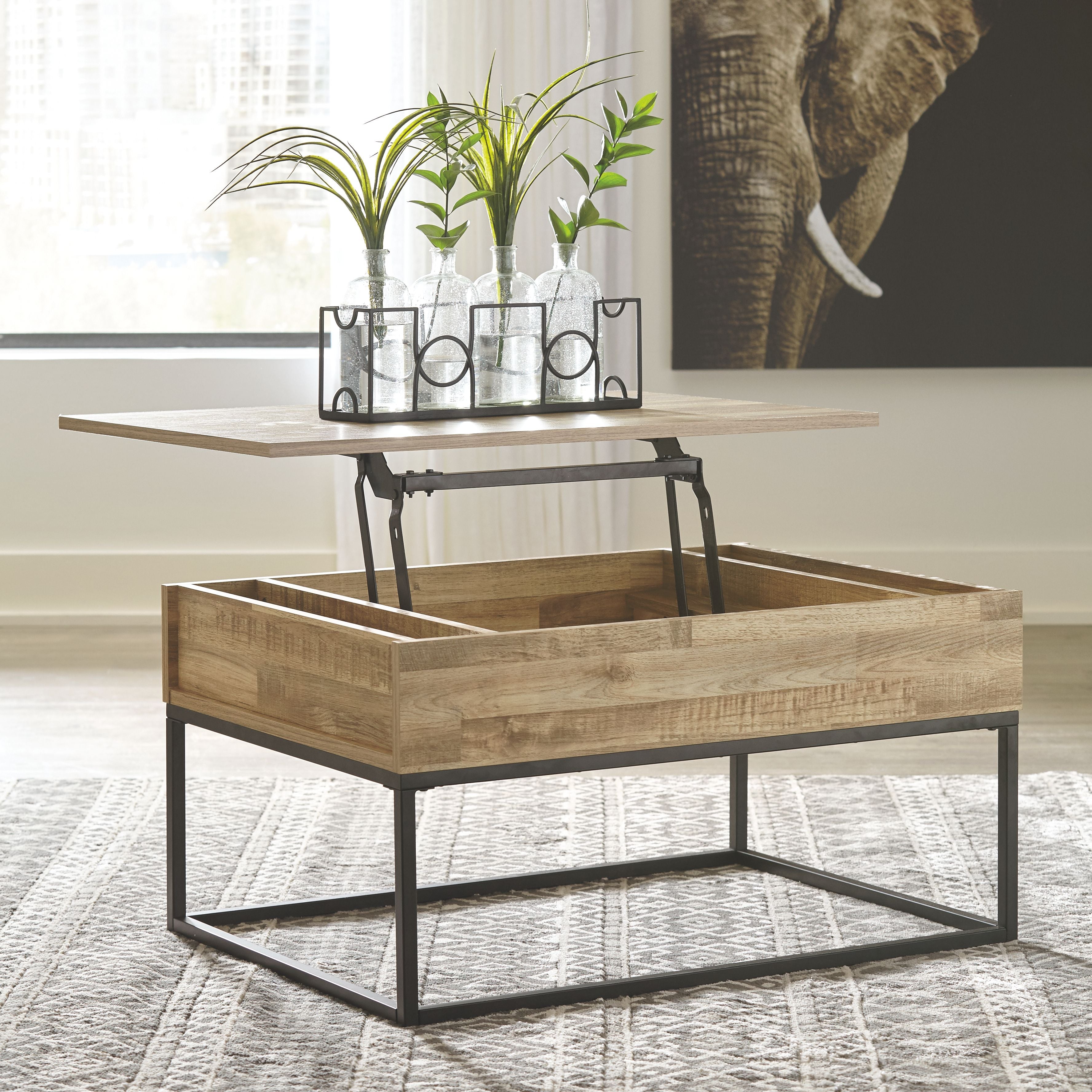 Lift-top cocktail table with light wood top lifted above open storage base