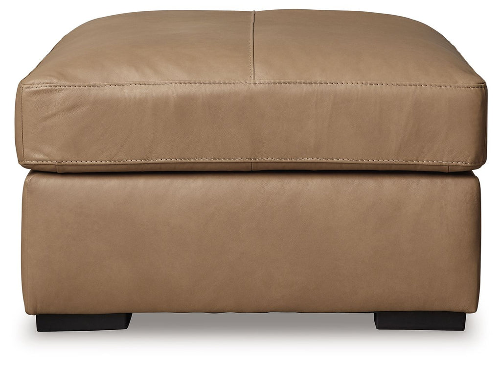Toffee oversized accent ottoman with tufted-style top and low black feet