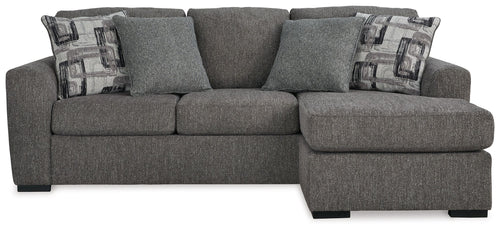 Pewter fabric sofa chaise with chaise ottoman, three back pillows and two patterned throws