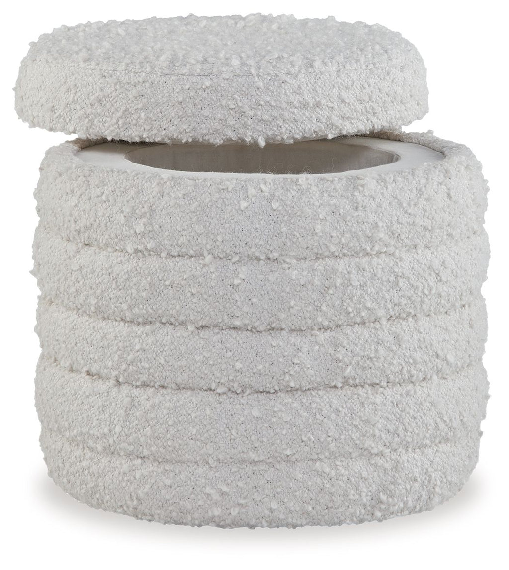 Ivory round storage ottoman with textured fabric and layered top lid