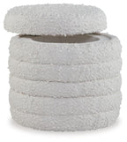 Ivory round storage ottoman with textured fabric and layered top lid