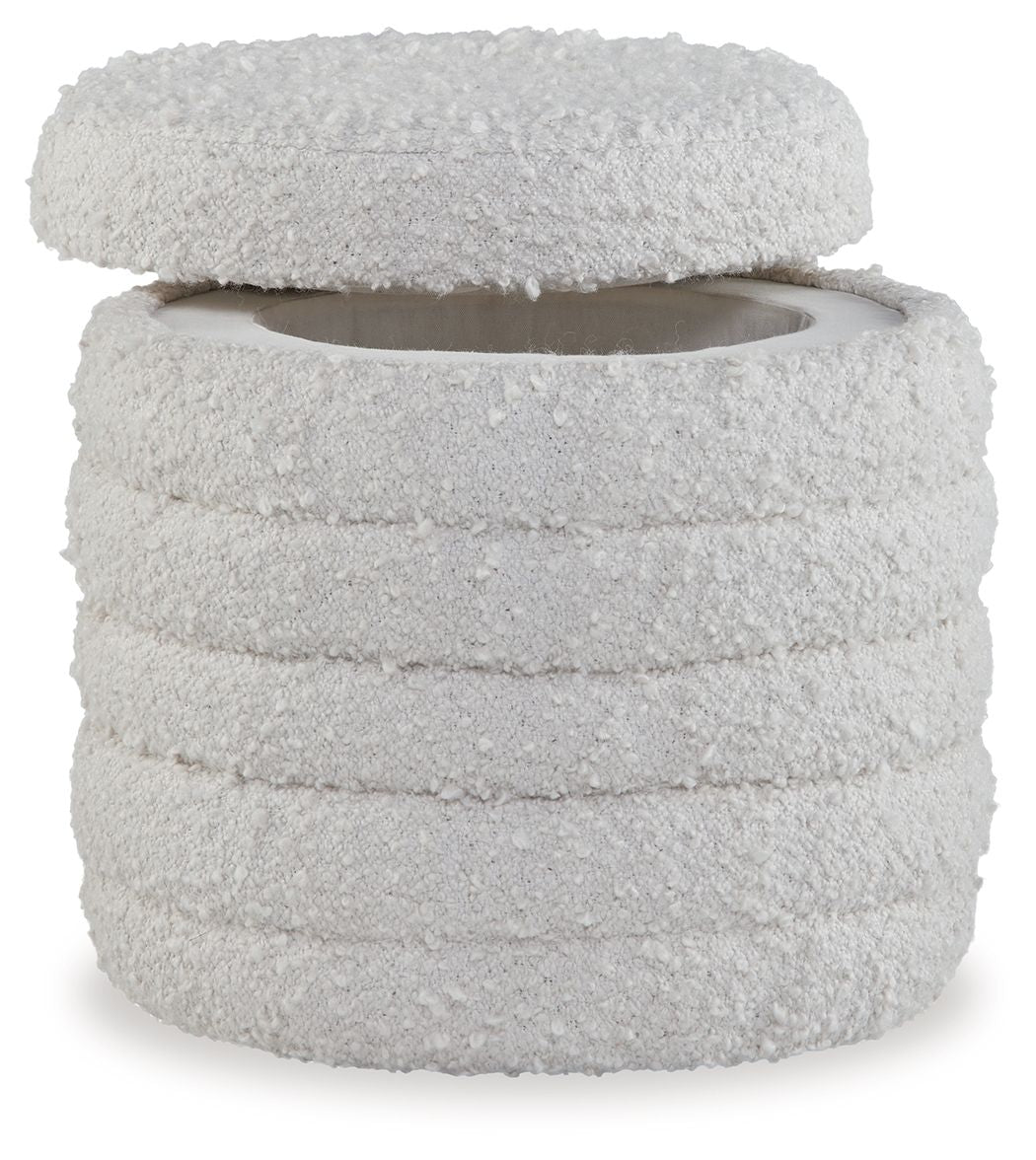 Ivory round storage ottoman with textured fabric and layered top lid