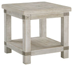 Rectangular end table with whitewashed gray wood and lower shelf, corner view of legs