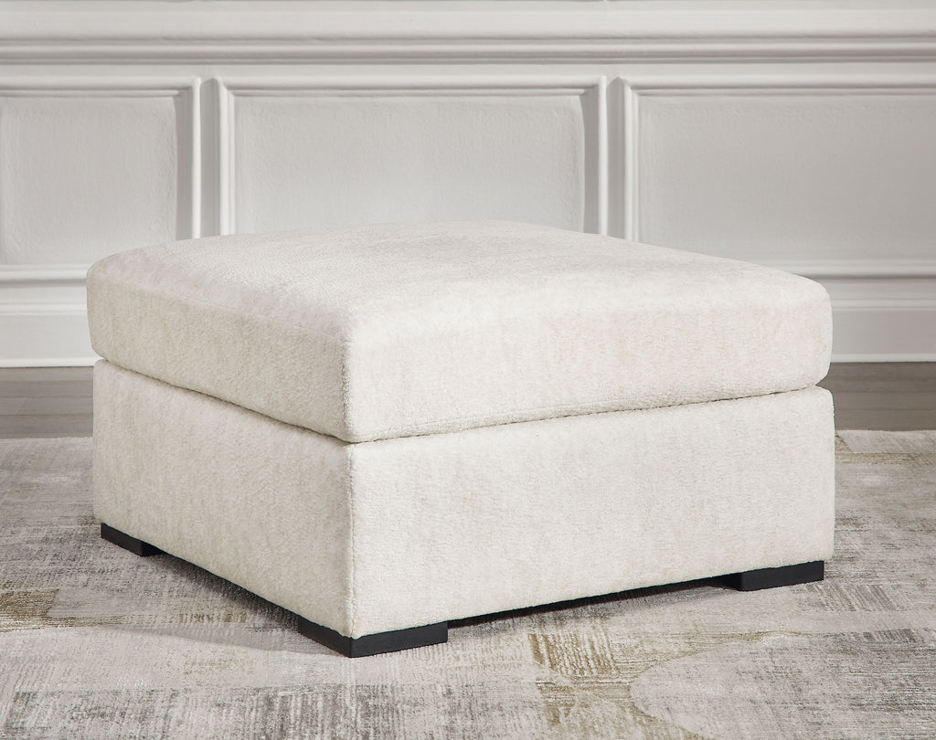 Ivory oversized accent ottoman, wide cushioned top and sturdy block legs