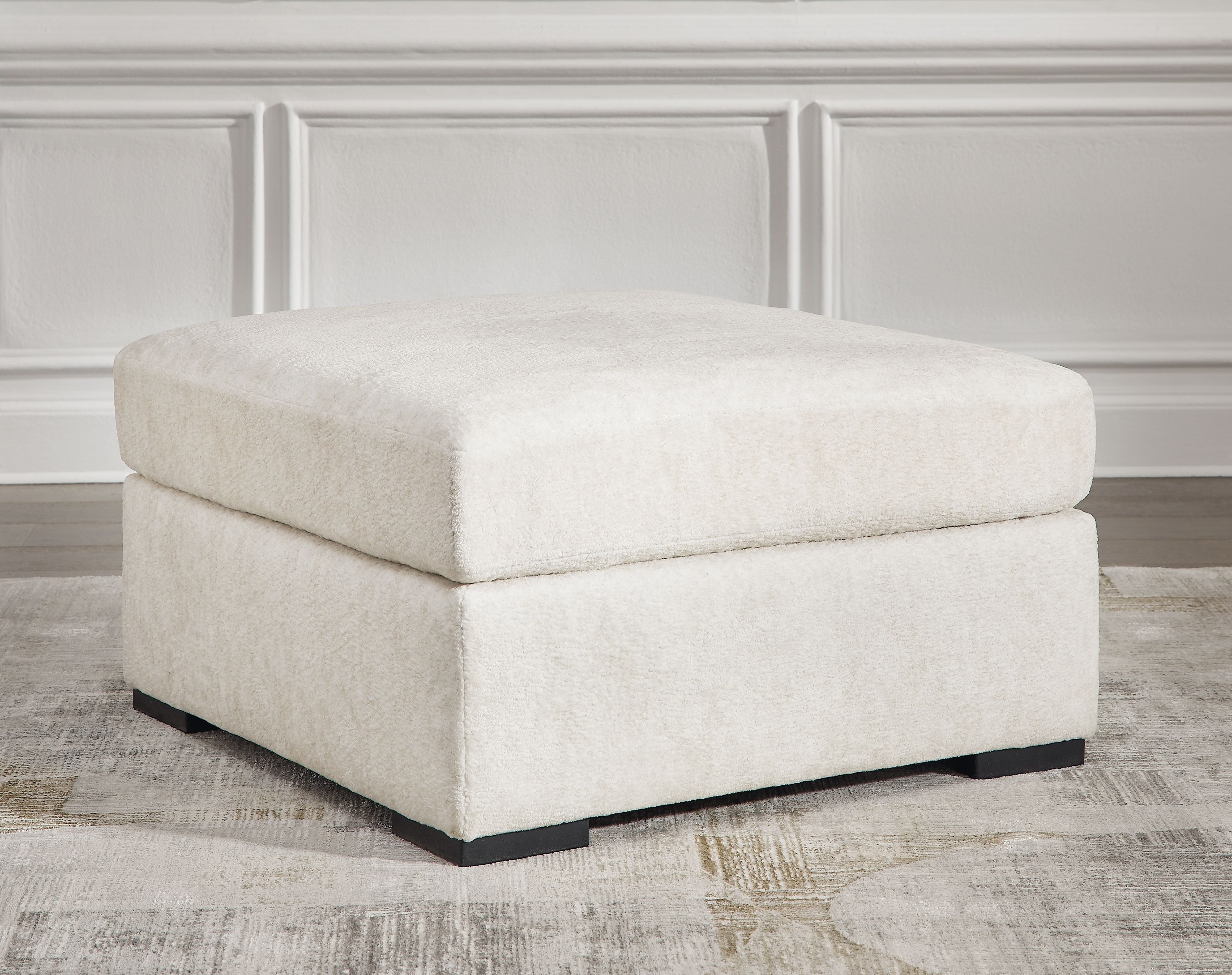 Ivory oversized accent ottoman, wide cushioned top and sturdy block legs