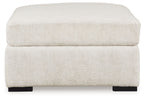 Ivory oversized accent ottoman with padded lid, straight sides, black feet