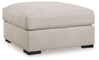 Sand-colored oversized accent ottoman with square top and dark block feet