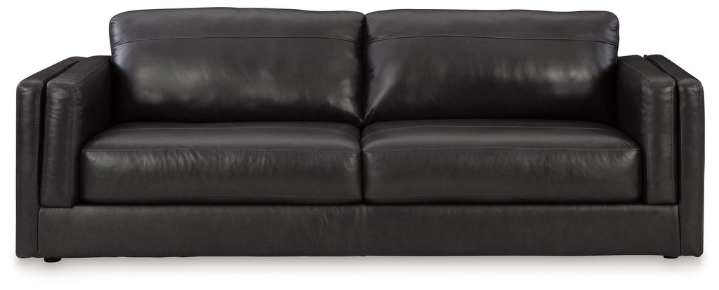 Dark leather sofa with two seat cushions and rolled arms