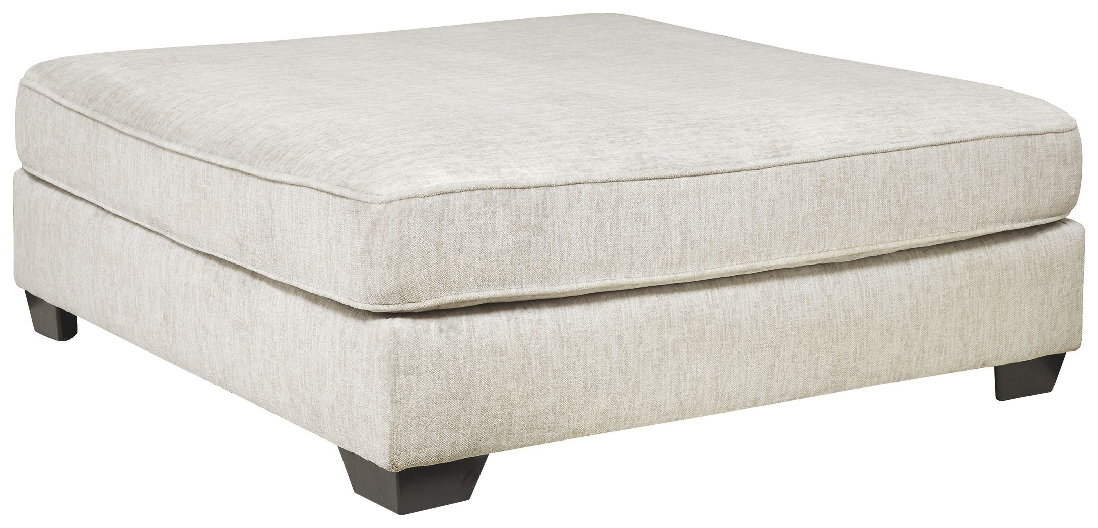 Oversized accent ottoman in parchment fabric with square top and dark legs